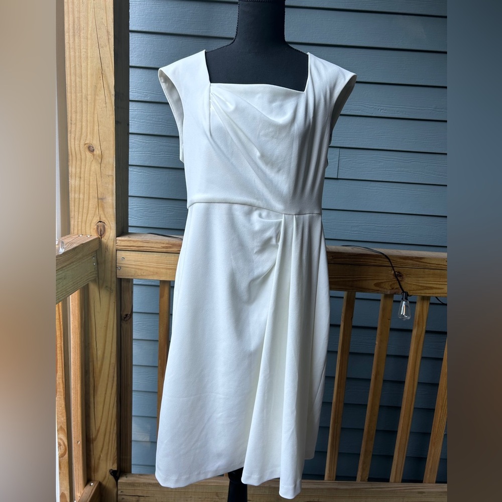 White size Calvin Klein dress. Zipper. Like new. Used twice. Size 14.